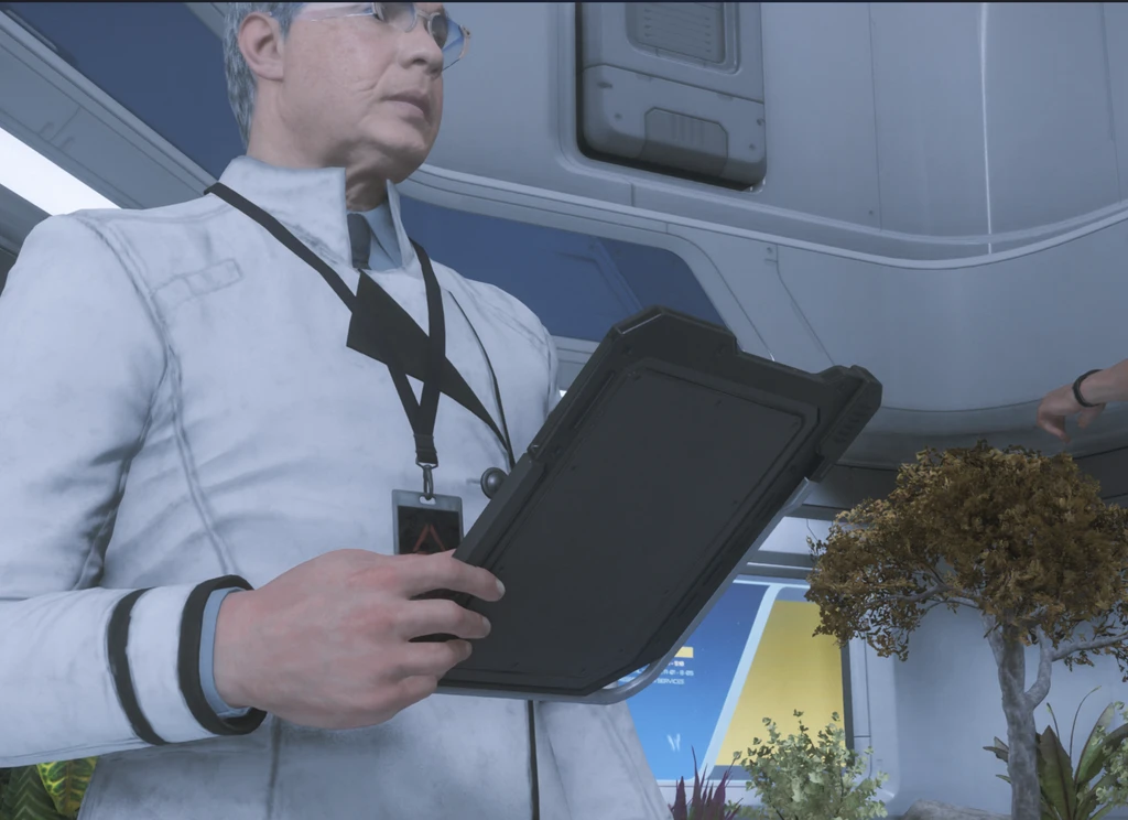 Scientist holding a tablet whilst inspecting something on front of them